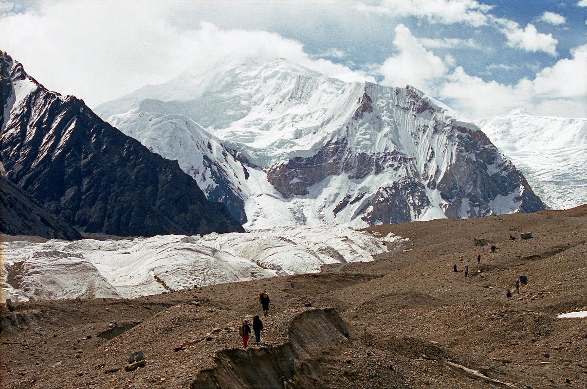 10 Trekking On The Upper Baltoro Glacier Towards Shagring Camp With Baltoro Kangri And Kondus Peak Baltoro Kangri and Kondus Peak lie ahead as we trek on the Upper Baltoro Glacier towards Shagring Camp.